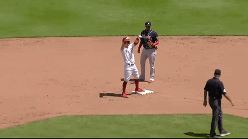 A Baseball Player With The Letter A On His Jersey Is Standing On The Base GIF