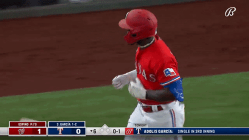 A Baseball Player With The Letter T On His Helmet Is Running On The Field GIF