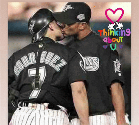 A Baseball Player With The Name Rodriguez On His Back Kisses Another Player GIF