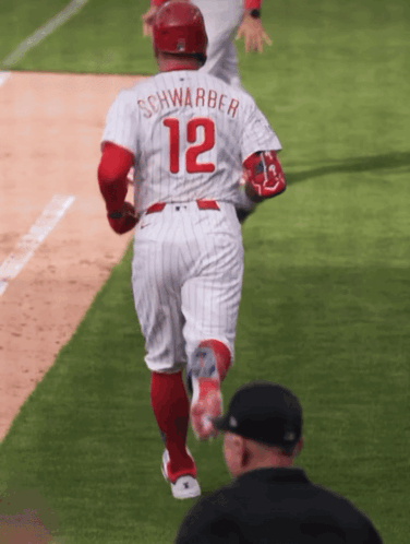 A Baseball Player With The Name Schwarber And The Number 12 GIF