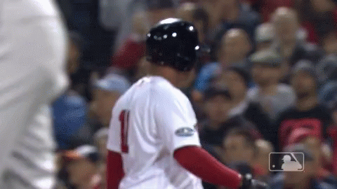 A Baseball Player With The Number 1 On His Jersey Stands In Front Of A Crowd GIF