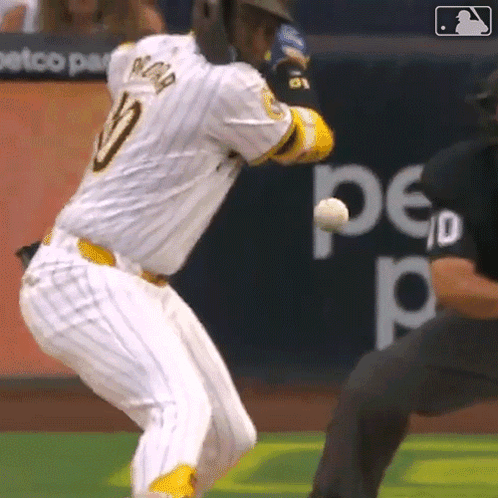 A Baseball Player With The Number 10 On His Jersey Is Swinging At A Ball GIF