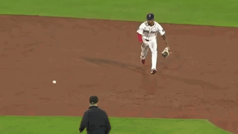 A Baseball Player With The Number 12 On The Back Of His Shirt GIF
