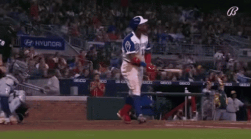 A Baseball Player With The Number 13 On His Jersey Is Standing On The Field Holding A Bat . GIF