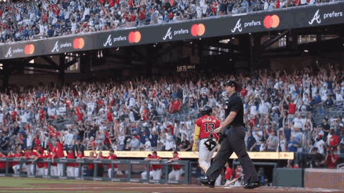 A Baseball Player With The Number 13 On The Back Of His Shirt GIF