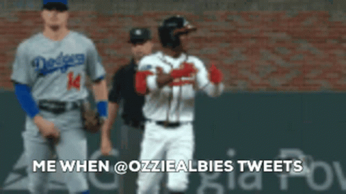 A Baseball Player With The Number 14 On His Jersey Is Talking To Another Player GIF