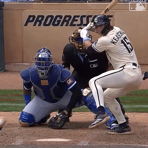 A Baseball Player With The Number 15 On His Jersey Is Swinging His Bat GIF