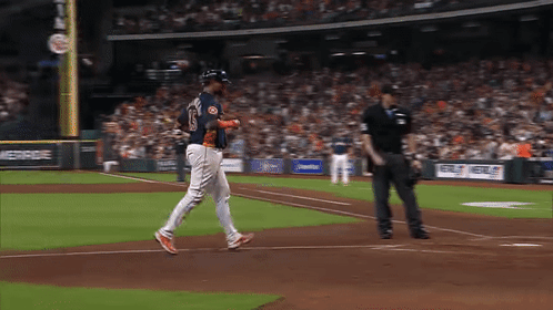 A Baseball Player With The Number 15 On His Jersey Is Walking On The Field GIF