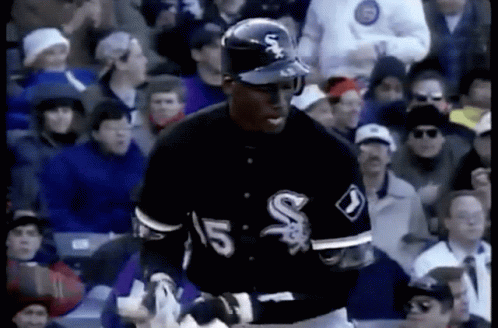 A Baseball Player With The Number 15 On His Jersey Stands In Front Of A Crowd GIF