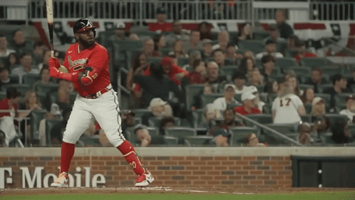 A Baseball Player With The Number 17 On His Jersey Is Swinging His Bat GIF