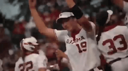 A Baseball Player With The Number 19 On His Jersey Is Standing In Front Of A Crowd . GIF