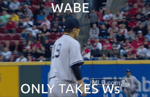 A Baseball Player With The Number 19 On His Jersey Stands On The Field GIF