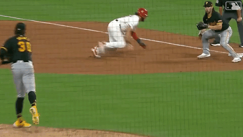 A Baseball Player With The Number 2 On His Jersey Is On The Ground GIF