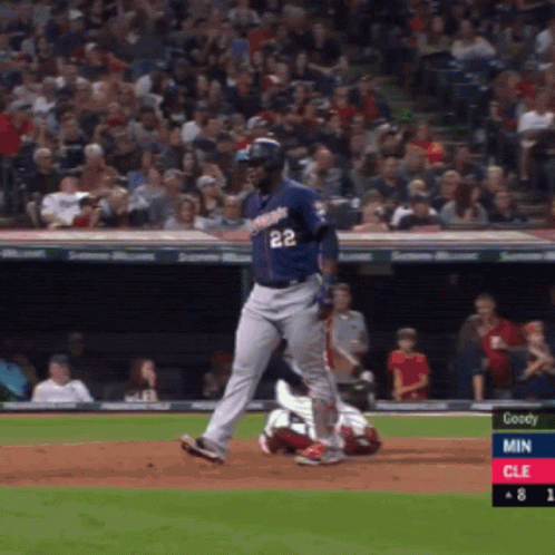 A Baseball Player With The Number 22 On His Jersey Is Running Towards Home Plate GIF