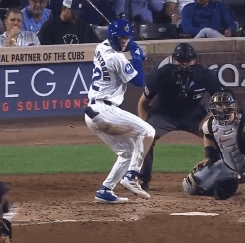 A Baseball Player With The Number 22 On His Jersey Is Swinging At A Pitch GIF