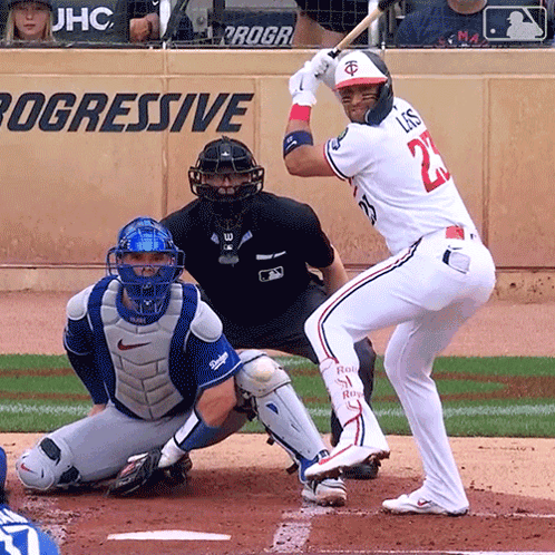 A Baseball Player With The Number 22 On His Jersey Swings At A Pitch GIF