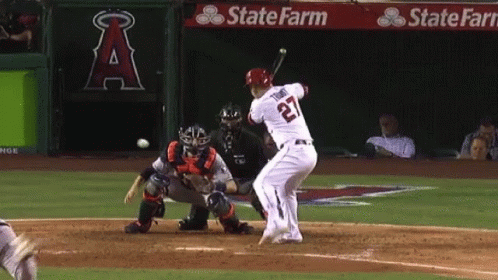 A Baseball Player With The Number 22 On His Jersey Swings His Bat GIF