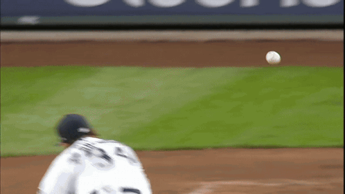 A Baseball Player With The Number 23 On His Back Throws The Ball GIF