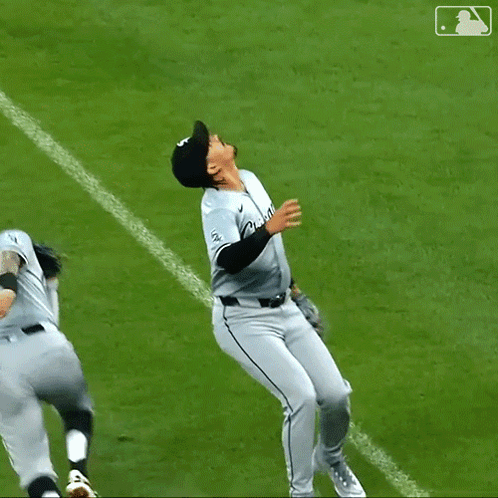 A Baseball Player With The Number 23 On His Jersey Is Hugging Another Player GIF
