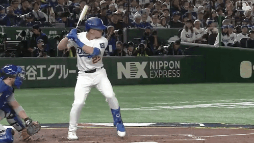 A Baseball Player With The Number 23 On His Jersey Swings At A Ball GIF