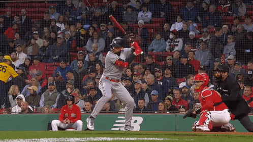 A Baseball Player With The Number 26 On His Jersey Swings His Bat GIF
