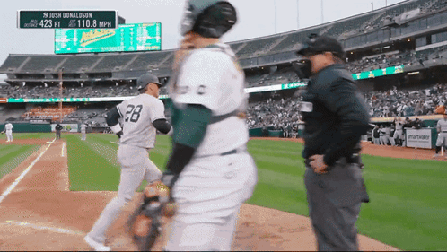 A Baseball Player With The Number 28 On His Back Stands On The Field GIF