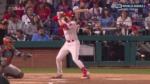 A Baseball Player With The Number 28 On His Jersey Swings At A Pitch GIF