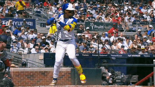 A Baseball Player With The Number 3 On His Jersey Swings His Bat GIF
