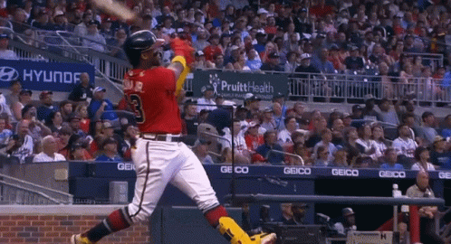 A Baseball Player With The Number 3 On His Shirt Swings His Bat GIF