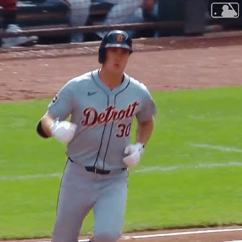 A Baseball Player With The Number 30 On His Jersey Is Running On The Field GIF