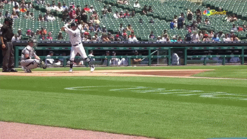A Baseball Player With The Number 33 On His Jersey Swings At A Pitch GIF
