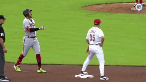 A Baseball Player With The Number 35 On His Jersey Stands On The Base GIF