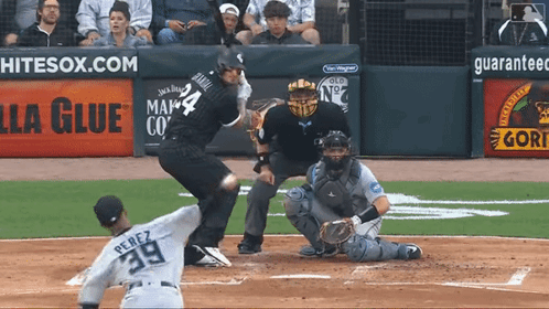 A Baseball Player With The Number 39 On The Back Of His Jersey Swings At A Pitch GIF