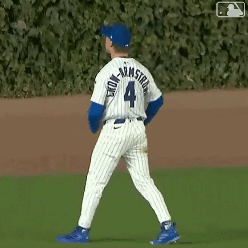 A Baseball Player With The Number 4 On His Jersey Is Walking On The Field GIF