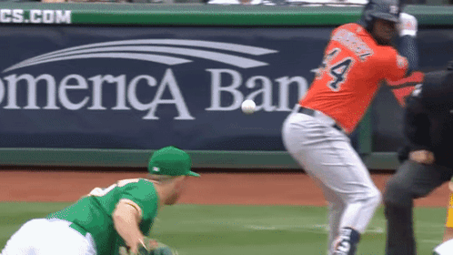 A Baseball Player With The Number 4 On His Jersey Swings At A Ball GIF