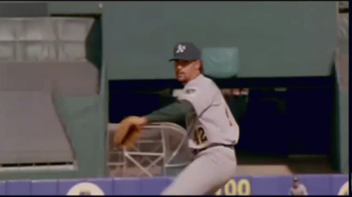 A Baseball Player With The Number 42 On His Jersey Is About To Throw The Ball GIF