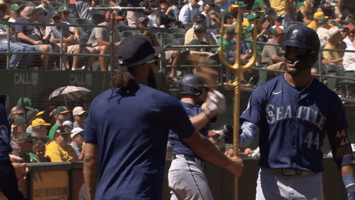A Baseball Player With The Number 44 On His Jersey Talks To Another Player GIF