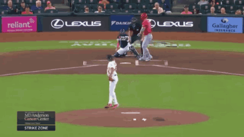 A Baseball Player With The Number 45 On His Jersey Stands At Home Plate GIF