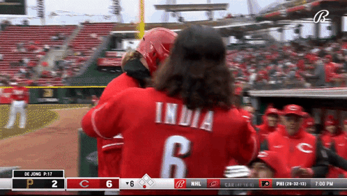 A Baseball Player With The Number 6 On His Back Is Hugging Another Player GIF