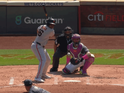 A Baseball Player With The Number 6 On His Jersey Swings At A Ball GIF