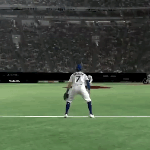 A Baseball Player With The Number 7 On His Back Is Standing On The Field . GIF
