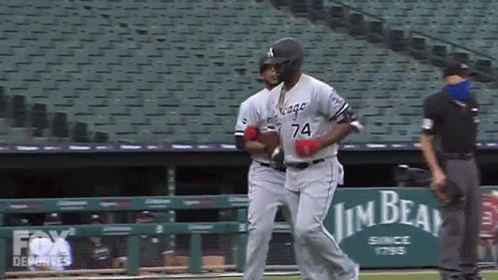 A Baseball Player With The Number 74 On His Jersey Runs Towards The Dugout GIF