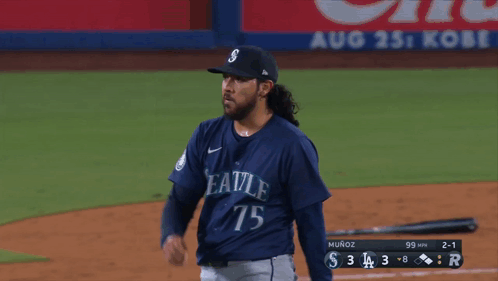 A Baseball Player With The Number 75 On His Jersey Stands On The Field GIF
