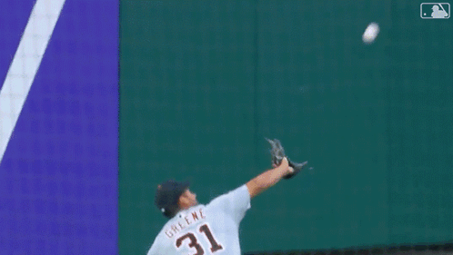 A Baseball Player With The Number 8 On His Jersey Is Laying On The Ground GIF