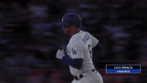 A Baseball Player With The Number 8 On His Jersey Reaches Up To Catch A Ball GIF