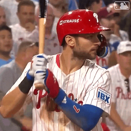 A Baseball Player With The Number 9 On His Helmet Is Holding A Bat GIF