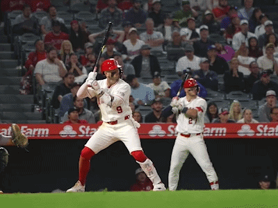 A Baseball Player With The Number 9 On His Jersey Swings His Bat GIF