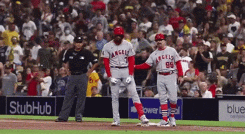 A Baseball Player With The Number 98 On His Jersey Stands On The Base GIF
