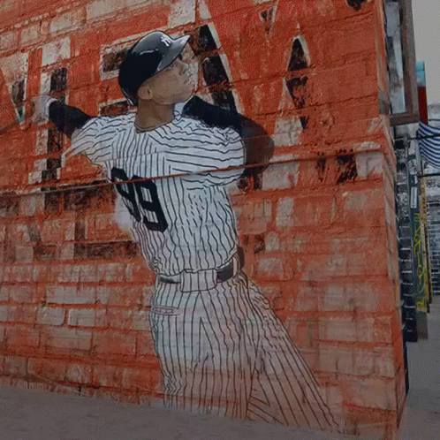 A Baseball Player With The Number 99 On His Shirt GIF