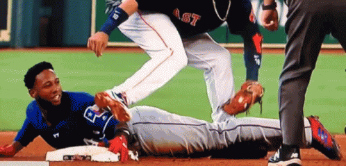 A Baseball Player With The Word Ast On His Shirt Is Laying On The Base GIF